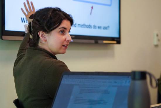 Alexandra Heaney, PhD, assistant professor, presenting to students during a lecture. 